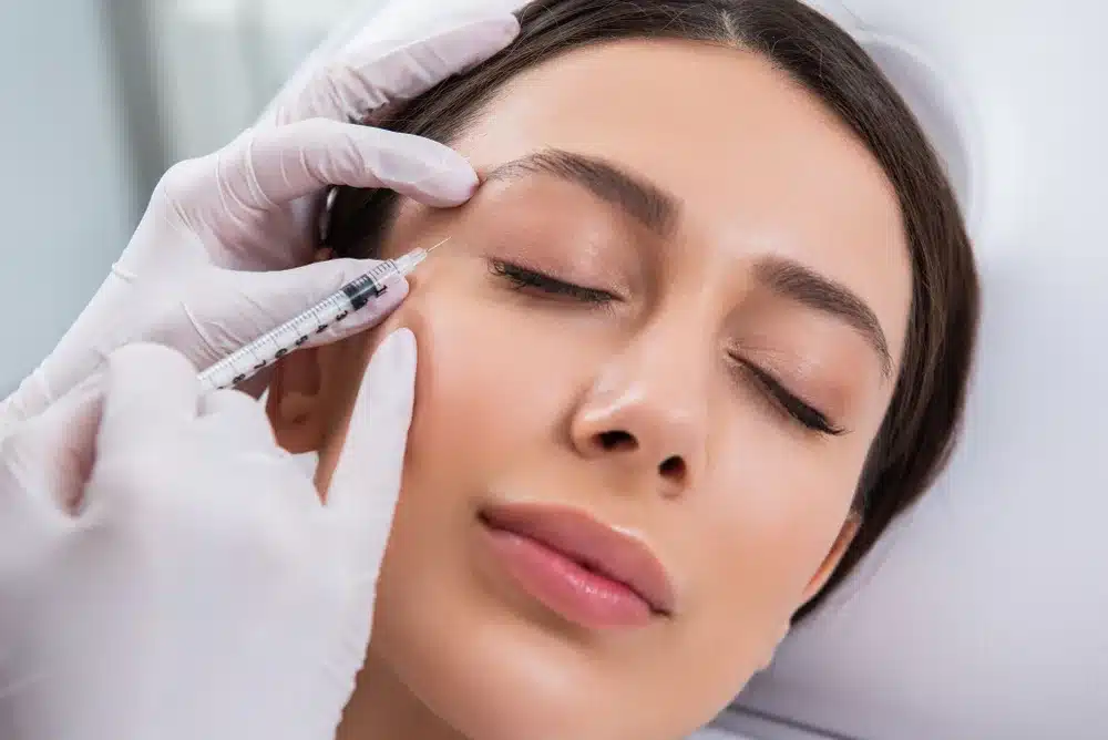 Close-up of a woman receiving a Dysport injection to smooth fine lines at The Luxe MedSpa