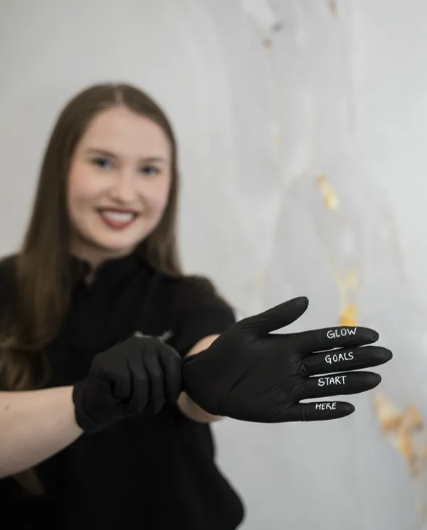 Woman with words written on glove